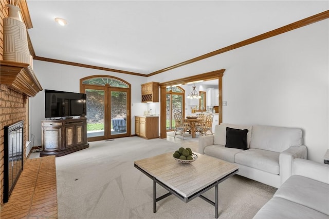 408 Bryn Ct, Ross Twp, PA 15237 - living room featuring a chandelier, light carpet, ornamental molding, and a fireplace