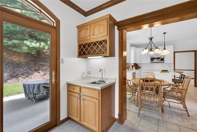 408 Bryn Ct, Ross Twp, PA 15237 - kitchen featuring stainless steel microwave, light countertops, healthy amount of natural light, light tile patterned flooring, and crown molding
