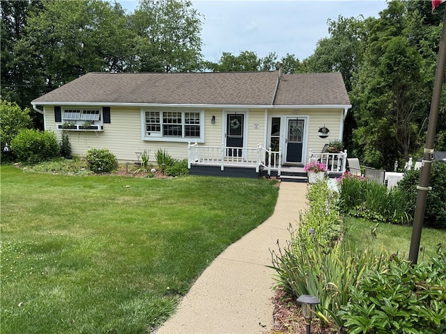 169 Orchard Dr, Brighton Twp, PA 15009 - view of front of home featuring a front lawn, roof with shingles, and covered porch