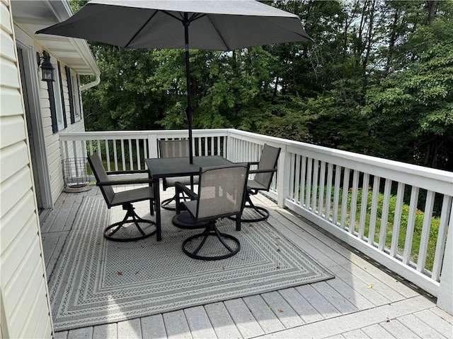 169 Orchard Dr, Brighton Twp, PA 15009 - wooden deck featuring outdoor dining area and view of wooded area