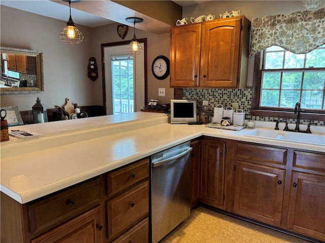 169 Orchard Dr, Brighton Twp, PA 15009 - kitchen featuring stainless steel dishwasher, light countertops, plenty of natural light, and a peninsula