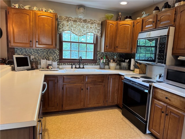 169 Orchard Dr, Brighton Twp, PA 15009 - kitchen featuring electric range, stainless steel microwave, and plenty of natural light