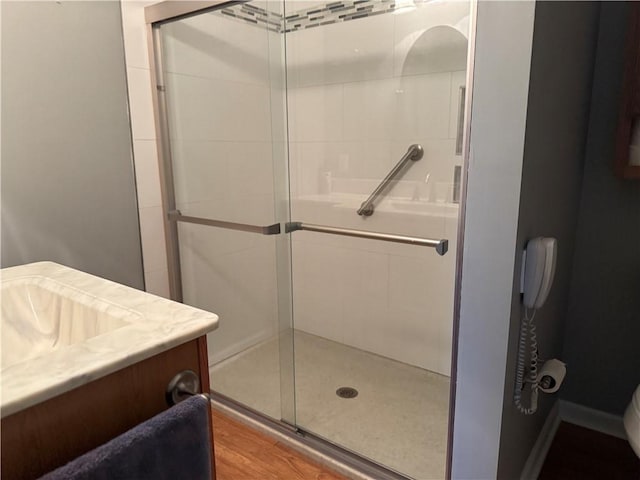1523 Timothy Dr, Derry Twp, PA 15650 - bathroom featuring a stall shower, vanity, and wood finished floors