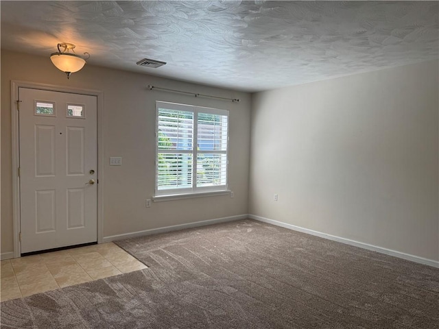 1523 Timothy Dr, Derry Twp, PA 15650 - entrance foyer featuring light carpet and a textured ceiling