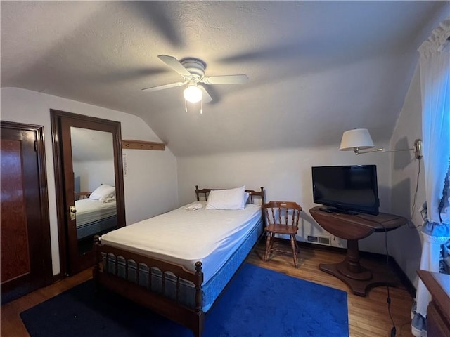 1104 Jefferson St, Mckeesport, PA 15132 - bedroom with lofted ceiling, wood finished floors, and a ceiling fan