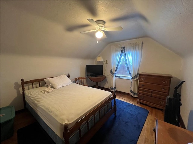 1104 Jefferson St, Mckeesport, PA 15132 - bedroom with wood finished floors, vaulted ceiling, ceiling fan, and a textured ceiling