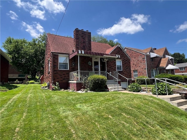 1104 Jefferson St, Mckeesport, PA 15132 - tudor house with brick siding, a chimney, and a front lawn