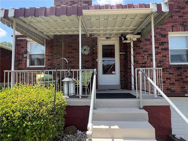 1104 Jefferson St, Mckeesport, PA 15132 - doorway to property with brick siding and a porch