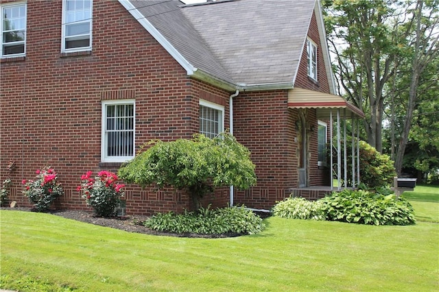 539 Milliken Ave, Sharpsville, PA 16150 - view of home's exterior with a yard, brick siding, and a shingled roof