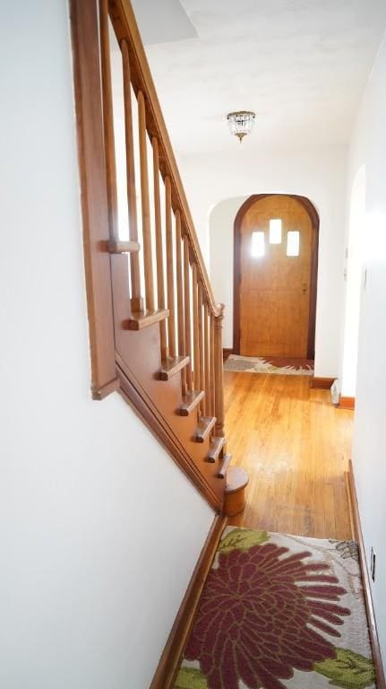 539 Milliken Ave, Sharpsville, PA 16150 - hallway featuring arched walkways, light wood-style flooring, and stairs
