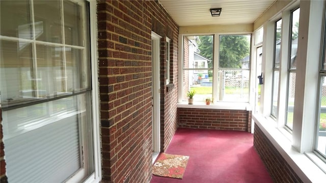 539 Milliken Ave, Sharpsville, PA 16150 - unfurnished sunroom featuring brick wall and carpet