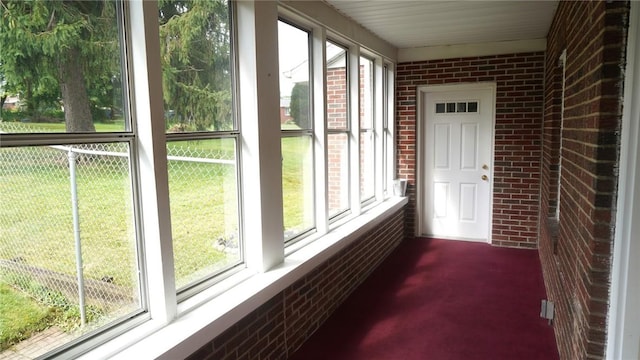539 Milliken Ave, Sharpsville, PA 16150 - unfurnished sunroom featuring brick wall, plenty of natural light, and carpet