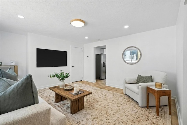 1233 High St, Spring Garden, PA 15212 - living room featuring light wood-style floors, recessed lighting, and a textured ceiling