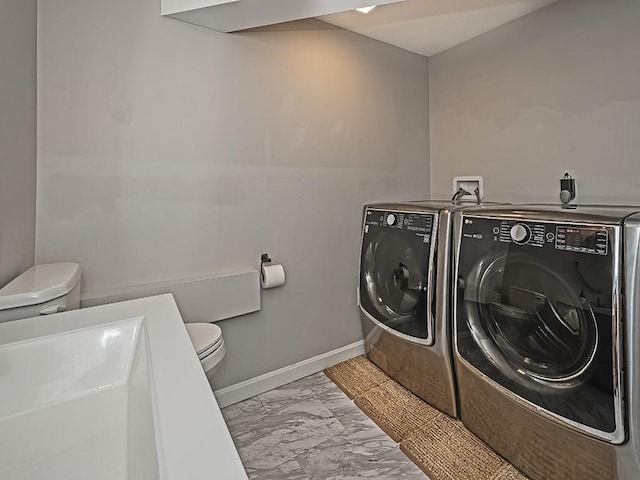 554 Rolling Green Dr, Bethel Park, PA 15102 - laundry area with washer and clothes dryer and marble look tile flooring