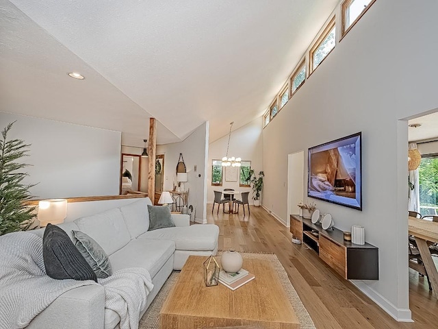 554 Rolling Green Dr, Bethel Park, PA 15102 - living area with light wood-style floors, a chandelier, high vaulted ceiling, and recessed lighting
