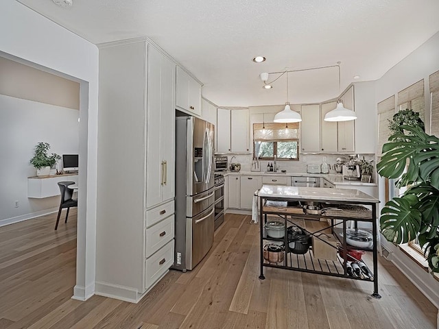 554 Rolling Green Dr, Bethel Park, PA 15102 - kitchen with stainless steel refrigerator with ice dispenser, light countertops, light wood finished floors, tasteful backsplash, and recessed lighting