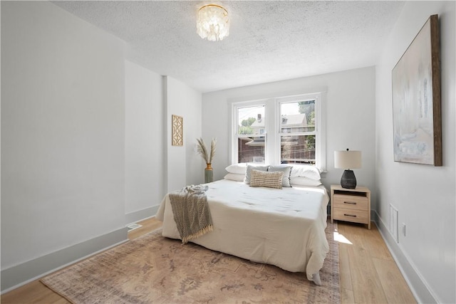3246 Piedmont Ave, Dormont, PA 15216 - bedroom featuring a textured ceiling and light wood-style flooring