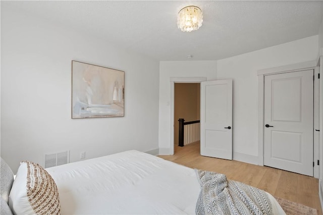 3246 Piedmont Ave, Dormont, PA 15216 - bedroom featuring wood finished floors and a chandelier