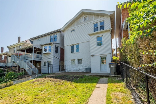 3246 Piedmont Ave, Dormont, PA 15216 - rear view of house with a fenced backyard and stone siding