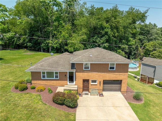 205 Eleanor Dr, Latrobe, PA 15650 - tri-level home featuring brick siding, concrete driveway, a garage, and a shingled roof