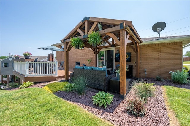 205 Eleanor Dr, Latrobe, PA 15650 - back of property with a deck, brick siding, and a yard