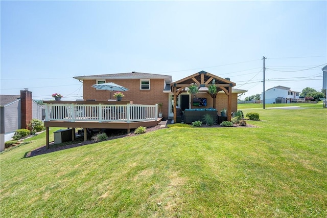 205 Eleanor Dr, Latrobe, PA 15650 - rear view of property featuring a gazebo, a wooden deck, a yard, and brick siding
