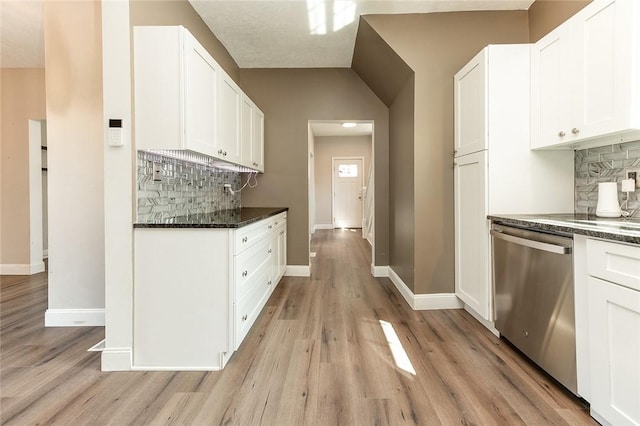 413 Spring St, Grove City Boro, PA 16127 - kitchen featuring stainless steel dishwasher, decorative backsplash, light wood-type flooring, white cabinetry, and lofted ceiling