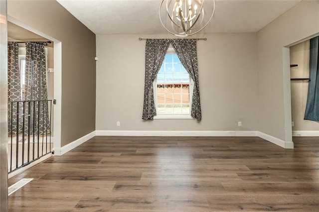 413 Spring St, Grove City Boro, PA 16127 - unfurnished room featuring a chandelier and wood finished floors