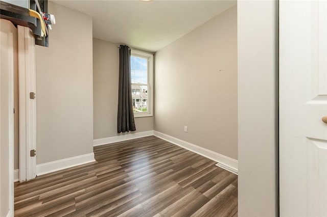 413 Spring St, Grove City Boro, PA 16127 - unfurnished bedroom with dark wood-style floors and baseboards