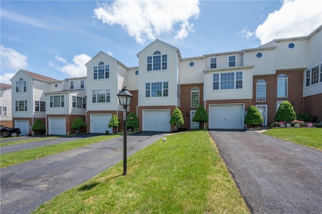 318 Links Ct, Salem Twp Wml, PA 15626 - multi unit property featuring brick siding, asphalt driveway, an attached garage, and a front yard