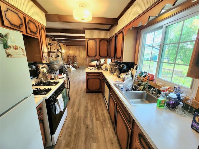 1426 S Darby Rd, Hermitage, PA 16148 - kitchen with white appliances, light countertops, beamed ceiling, light wood-style floors, and plenty of natural light