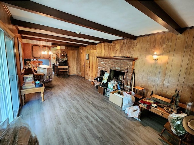 1426 S Darby Rd, Hermitage, PA 16148 - living area featuring beam ceiling, dark wood finished floors, a chandelier, a fireplace, and wood walls