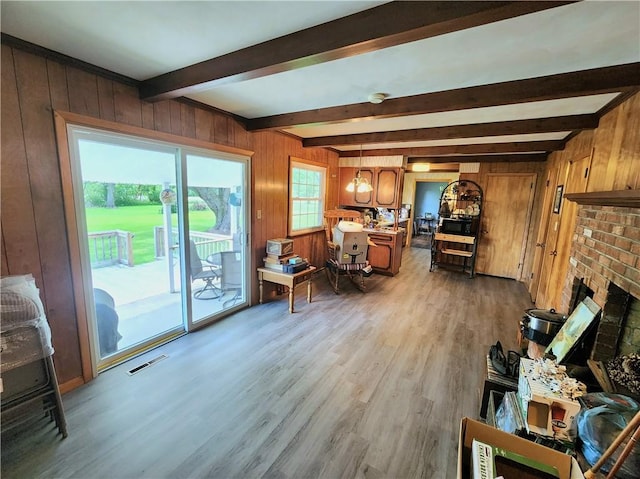 1426 S Darby Rd, Hermitage, PA 16148 - living area featuring beamed ceiling, wood walls, wood finished floors, and a fireplace