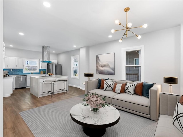 710 7th Ave, New Brighton, PA 15066 - living room with wood finished floors, healthy amount of natural light, recessed lighting, and a chandelier