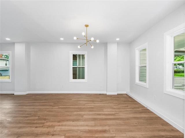 710 7th Ave, New Brighton, PA 15066 - unfurnished room featuring a chandelier, recessed lighting, and light wood-style floors