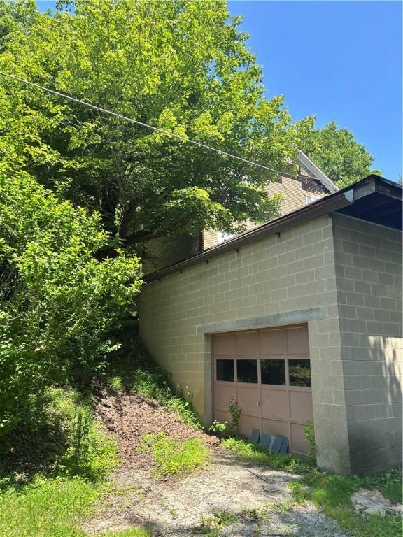 65 Old Mine Rd, Center Twp/Homer Cty, PA 15748 - view of home's exterior featuring concrete block siding and a garage