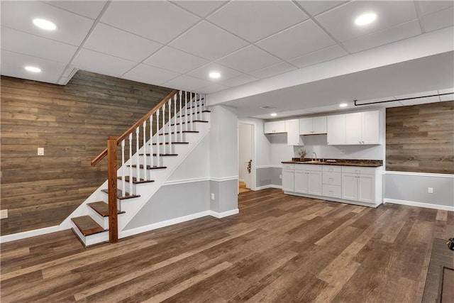 2161/2 Robin Hood Dr, Irwin, PA 15642 - kitchen featuring wood walls, dark countertops, dark wood finished floors, white cabinets, and recessed lighting