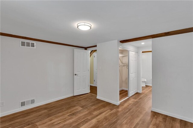 2161/2 Robin Hood Dr, Irwin, PA 15642 - spare room with wood finished floors, arched walkways, and recessed lighting
