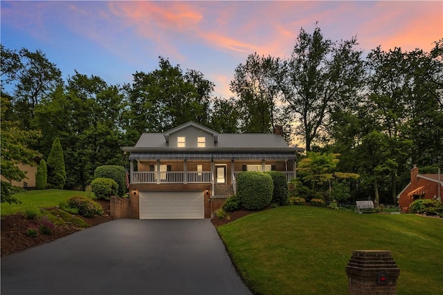 2161/2 Robin Hood Dr, Irwin, PA 15642 - view of front of property featuring driveway, a yard, and an attached garage