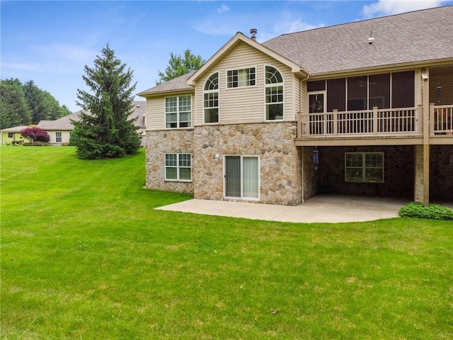 6092 Triple Crown Cir, Hempfield Twp, PA 15601 - back of property with a patio, stone siding, a lawn, and a shingled roof