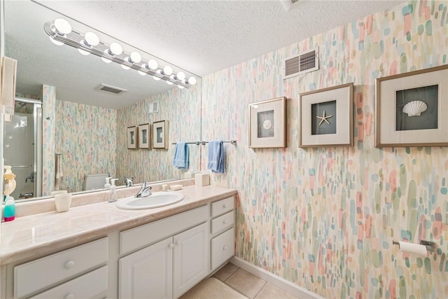 6092 Triple Crown Cir, Hempfield Twp, PA 15601 - bathroom with wallpapered walls, tile patterned floors, vanity, a textured ceiling, and a shower stall