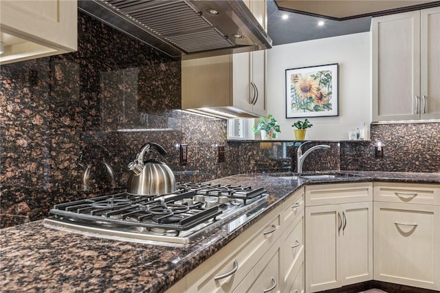 6092 Triple Crown Cir, Hempfield Twp, PA 15601 - kitchen with ventilation hood, stainless steel gas stovetop, backsplash, dark stone counters, and white cabinets