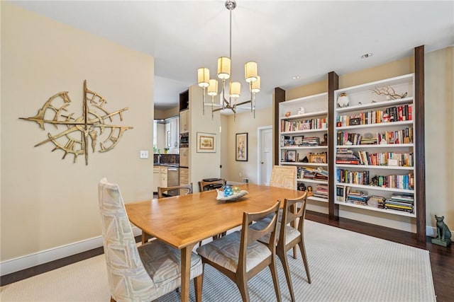 6092 Triple Crown Cir, Hempfield Twp, PA 15601 - dining space with a chandelier and dark wood-style floors