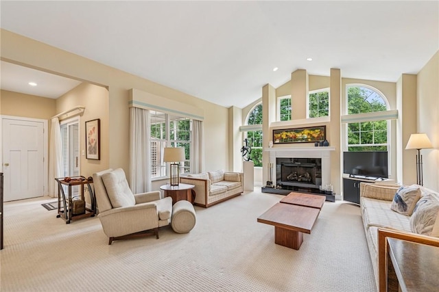 6092 Triple Crown Cir, Hempfield Twp, PA 15601 - carpeted living room with plenty of natural light, a fireplace with raised hearth, lofted ceiling, and recessed lighting