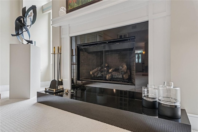 6092 Triple Crown Cir, Hempfield Twp, PA 15601 - detailed view of a fireplace and carpet flooring