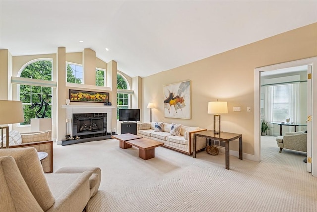 6092 Triple Crown Cir, Hempfield Twp, PA 15601 - living room with carpet, healthy amount of natural light, a fireplace with raised hearth, recessed lighting, and high vaulted ceiling