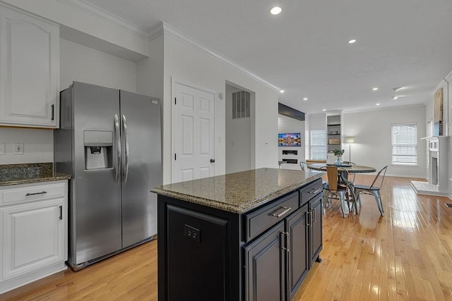642 Water View Dr, Cranberry Twp, PA 16066 - kitchen with stainless steel fridge with ice dispenser, crown molding, light wood-style floors, dark stone counters, and recessed lighting