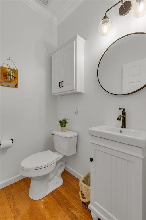 642 Water View Dr, Cranberry Twp, PA 16066 - half bath with crown molding, vanity, and wood finished floors