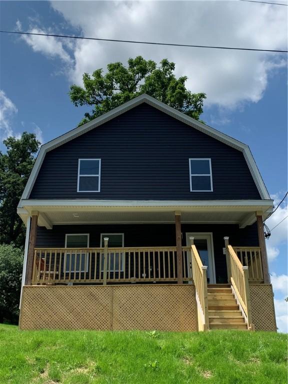 226 Main Street Ext, Callery Boro, PA 16024 - dutch colonial featuring covered porch, a gambrel roof, and stairs