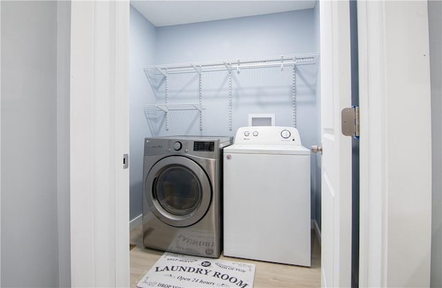 226 Main Street Ext, Callery Boro, PA 16024 - laundry room featuring washing machine and clothes dryer and light wood-style floors